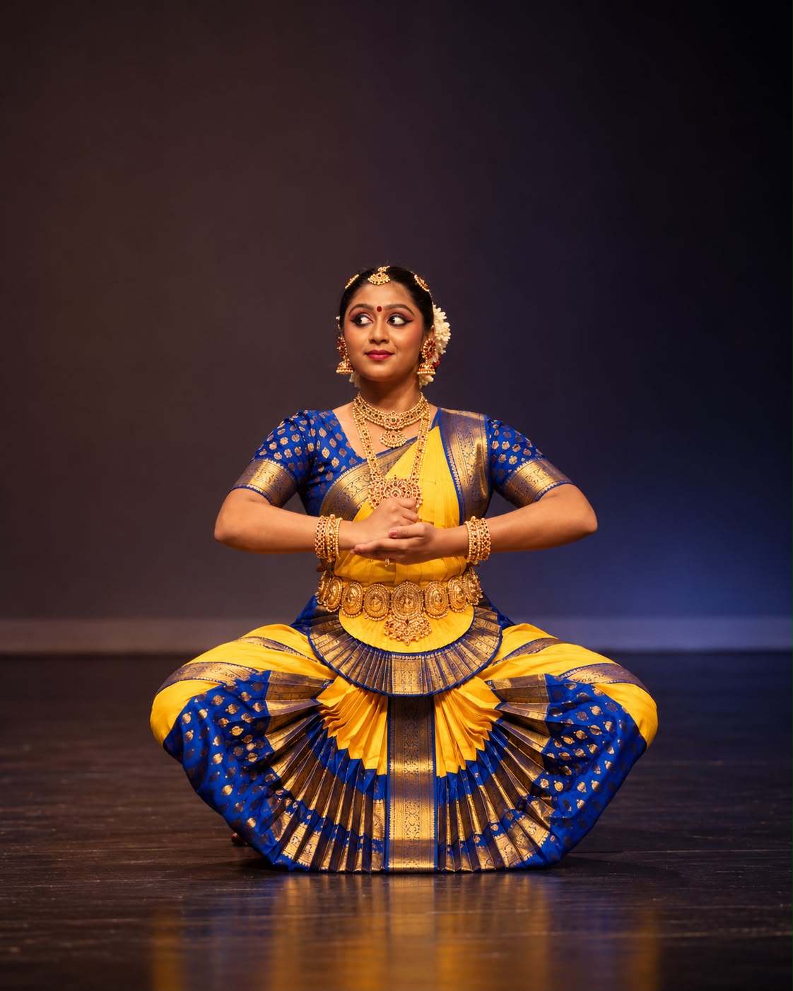 Shivanshi Sia Thakur in a blue and yellow Bharatanatyam costume